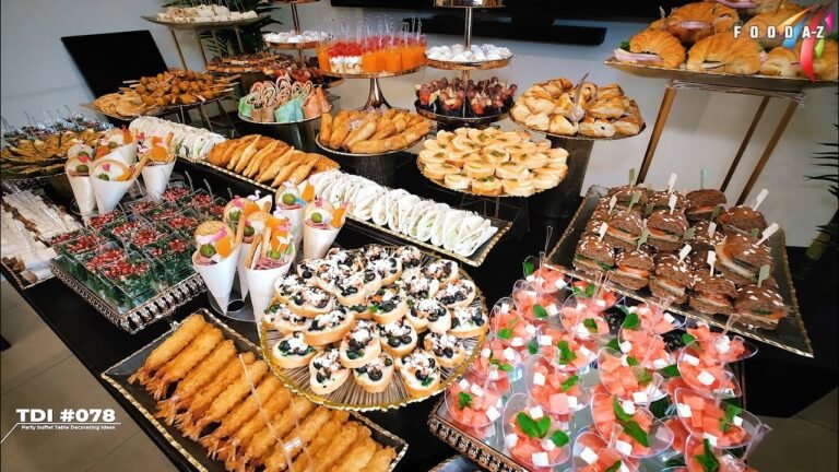 juhlajarjestelyt tarjoilupoyta taynna herkkuja