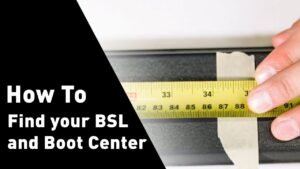 laskettelija valitsee suksia mittanauhalla