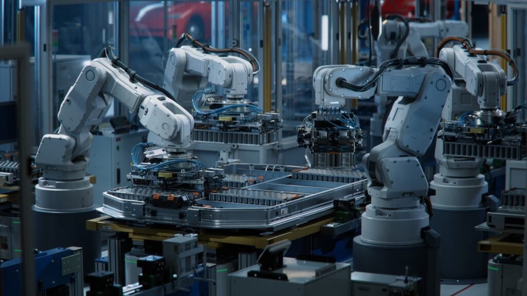 moderni tehdas robottiarmoineen tyoskentelee