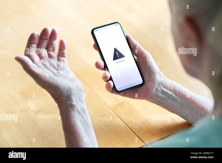 puhelin jonka naytto nayttaa virheilmoituksen